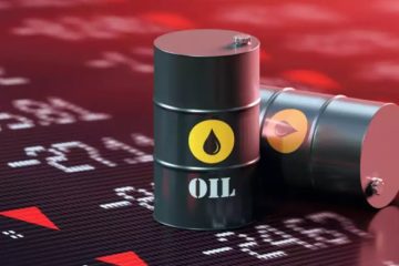 Barris de petróleo sobre painel de cotações em queda